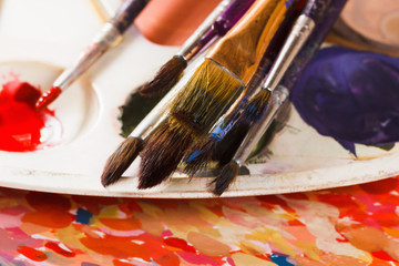 Obraz premium Set of watercolor paints and paintbrushes for painting