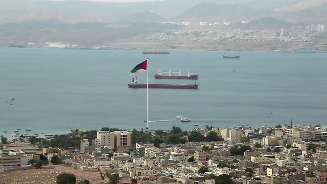 View of Aqaba city in Jordan and Eilat city in Israel. View from mountain in Aqaba city in Jordan. Two city and two country in one video clip