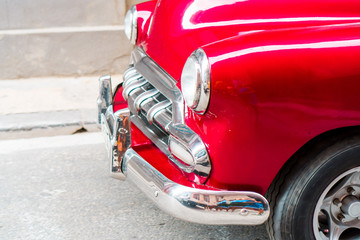 Closeup of red classic vintage car in Old Havana, Cuba