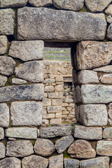 Window at House of Three Doorways at Machu Picchu ruins, Peru
