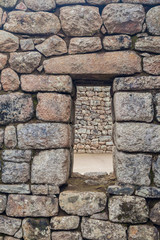 Window at House of Three Doorways at Machu Picchu ruins, Peru