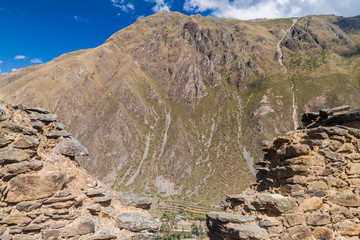 View of Sacred Valley of Incas behind ruined wall, Peru
