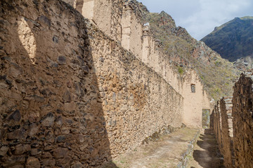 Ruins of Pinkulluna (Inca storehouses) above village Ollantaytambo, Sacred Valley of Incas, Peru