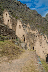 Fototapeta premium Ruins of Pinkulluna (Inca storehouses) above village Ollantaytambo, Sacred Valley of Incas, Peru