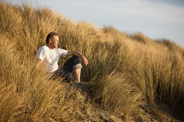 Mature man looking into the distance.