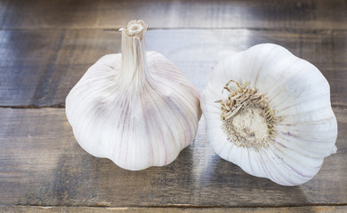 Sliced garlic ,garlic cloves on wooden vintage background