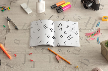 Open notebook with letters on it