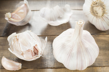 Sliced garlic ,garlic cloves on wooden vintage background