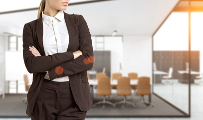 Fototapeta premium Confident woman in office hall, close up
