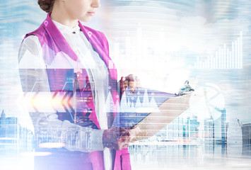 Woman with clipboard in a city, graph