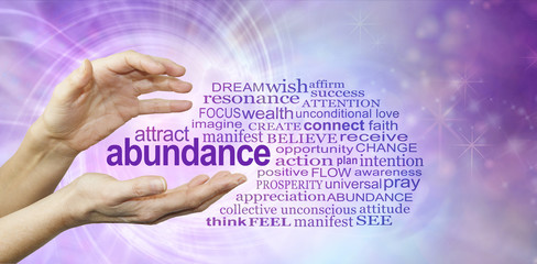 Attract Abundance Word Cloud - female hands with the word ABUNDANCE  floating between surrounded by...