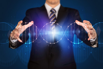 Businessman holding DNA