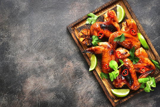 Grilled spicy chicken wings.Top view with copy space.