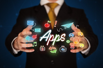 Businessman holding apps