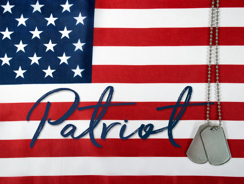 word patriot and military dog tags on American flag