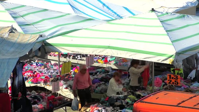 timelapse of women shopping among market stalls