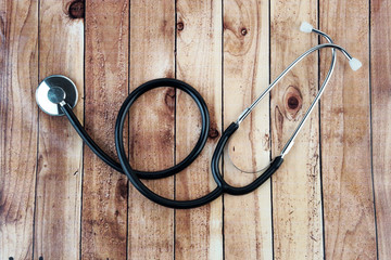 Stethoscope On Wooden Background. 