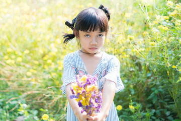 so cute asian little children girl holding flower in her hand