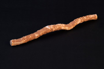 Traditional Natural Toothbrush Miswak or Siwak On Black Background.