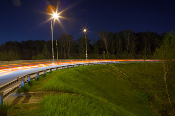 Urban city road with car light trails at night	