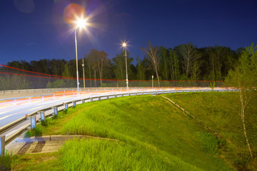 Urban city road with car light trails at night	