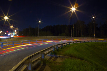 Urban city road with car light trails at night	