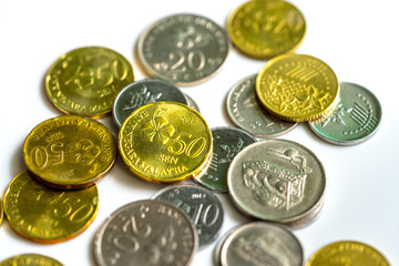 Malaysia Ringgit (MYR) coins over white background. Currency of Malaysia