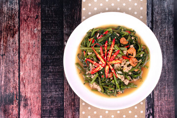 Fried spicy Chinese morning glory with minced pork and dried shrimps .