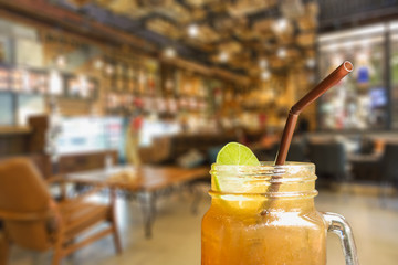 ice tea with slice of lemon in mason jar