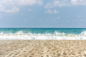 Fototapeta na wymiar tropical beach and wave against blue sky