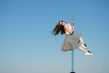Girl dancing on a pole