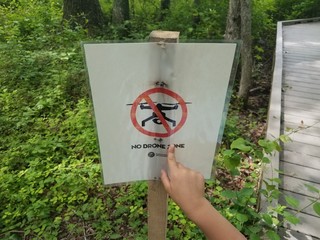 no drone sign in the woods near boardwalk