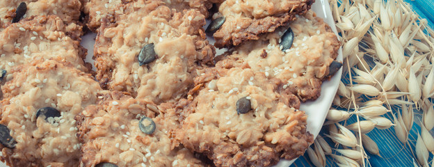 Vintage photo, Fresh oatmeal cookies and ears of oat, healthy dessert concept