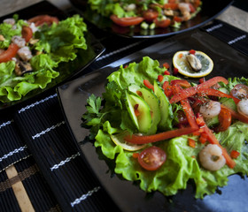 delicious salad over black plate
