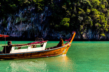 long tail boat with a monk at Andaman sea
