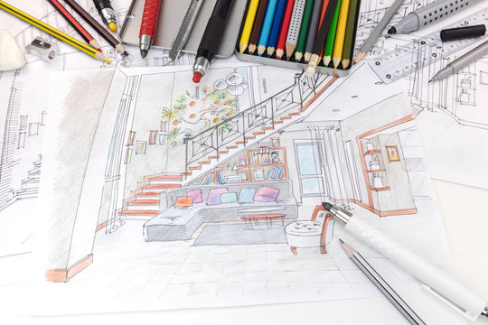 color pens, rulers and other drawing tools on hand drawn draft sketch of living room interior