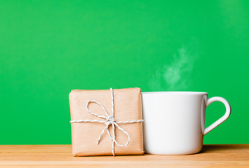 Obraz na płótnie Canvas cup of coffee and gift