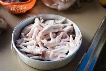 Fresh chicken foot in the kitchen