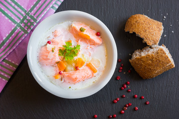 Salmon fish soup with cream in a bowl