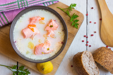 Salmon fish soup with cream in a bowl