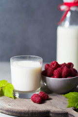 Fresh cow milk and ripe organic red raspberry