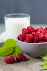 Fresh cow milk and ripe organic red raspberry
