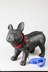 Plastic dog mannequin with dog tape collar in red and blue roulette lead