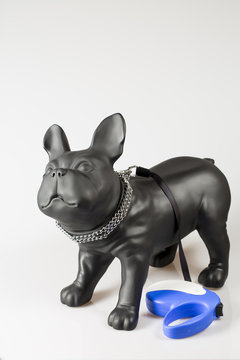 Plastic dog mannequin with dog metal collar and roulette lead in blue