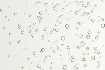 Fototapeta na wymiar Beautiful champagne bubbles soars over a blurred background