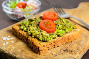 Avocado toast with whole wheat bread and vegetable salad