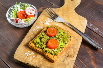 Avocado toast with whole wheat bread and vegetable salad