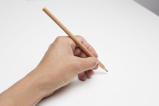 hand holding pencil