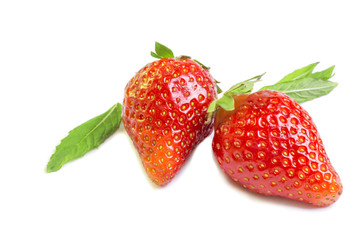 Two ripe juicy bright strawberries