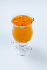 Tea with sea buckthorn on white background